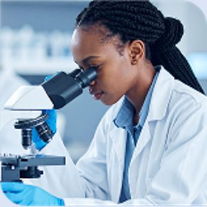 Scientist at microscope